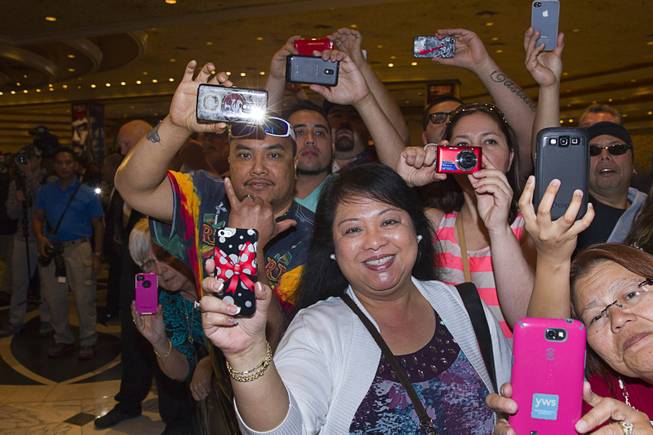 Fans wait for boxer Manny Pacquiao of the Philippines at the MGM Grand Tuesday, April 8, 2014. Pacquiao will challenge undefeated WBO welterweight champion Timothy Bradley at the MGM Grand Garden Arena on Saturday. The fight is a rematch to a June 9, 2012 fight that Bradley won.