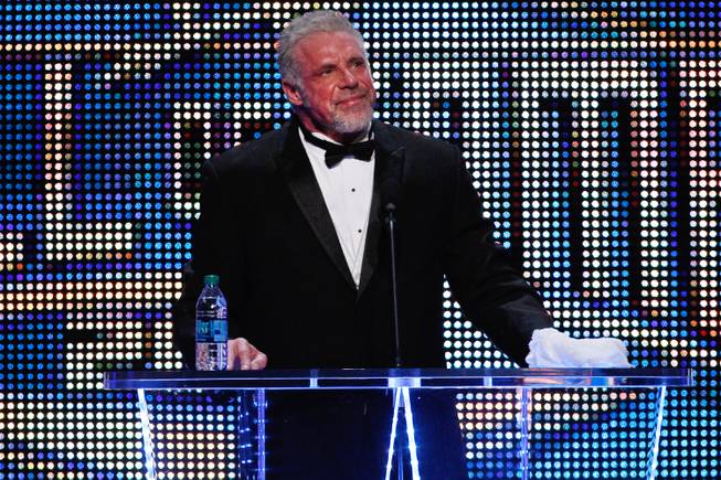 In this April 5, 2014, file photo provided by the WWE, James Hellwig, aka The Ultimate Warrior, speaks during the WWE Hall of Fame Induction at the Smoothie King Center in New Orleans.