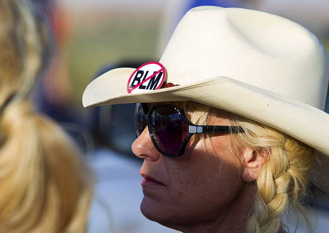 A woman wears a "No BLM" button on her hat during a protest in support of the Bundy family near Bunkerville Thursday, April 10, 2014.