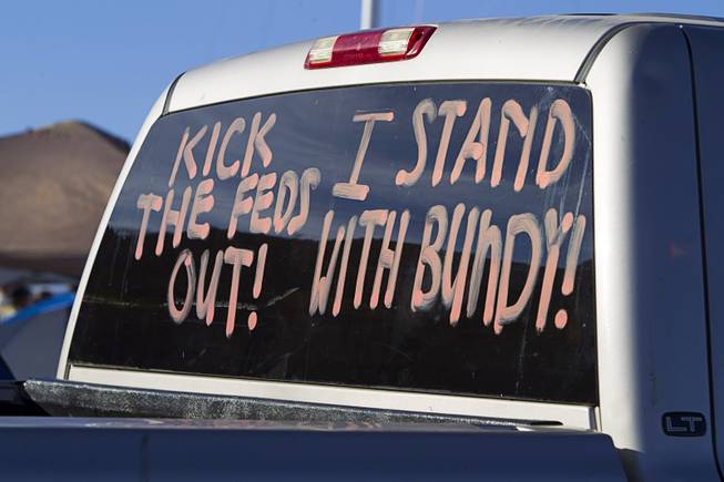 A message is shown on the rear window of a pickup truck during a protest in support of the Bundy family near Bunkerville Thursday, April 10, 2014.