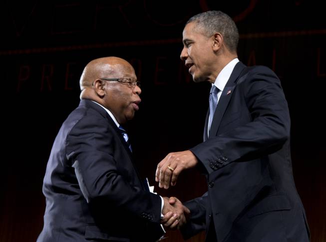 President Barack Obama is greeted by Rep. John Lewis, D-Ga., as he arrives to speak at the LBJ Presidential Library on Thursday, April 10, 2014, in Austin, Texas, during the Civil Rights Summit to commemorate the 50th anniversary of the signing of the Civil Rights Act. Lewis withstood violence and arrest during the Civil Rights marches through Alabama in the mid-1960s.