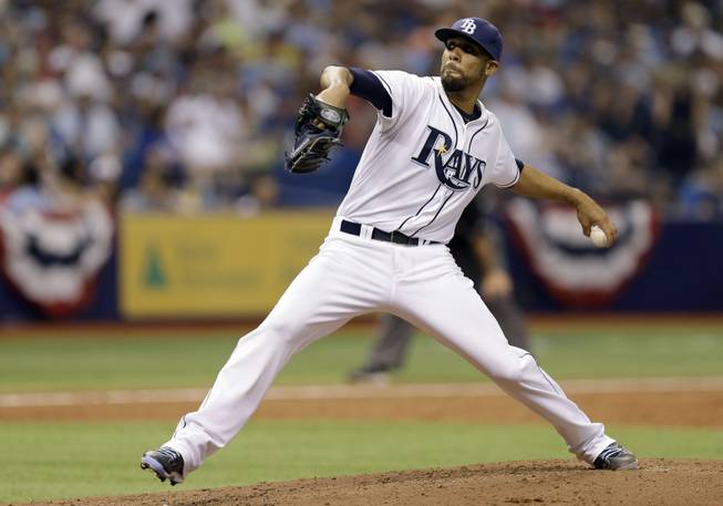 Tampa Bay Rays pitcher David Price delivers to the Toronto Blue Jays during the fourth inning of a game Monday, March 31, 2014, in St. Petersburg, Fla.