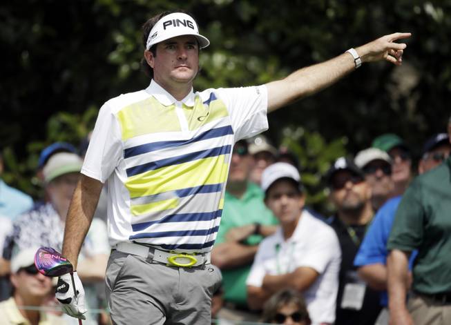 Bubba Watson points to his tee shot on the ninth hole during the second round of the Masters golf tournament Friday, April 11, 2014, in Augusta, Ga.