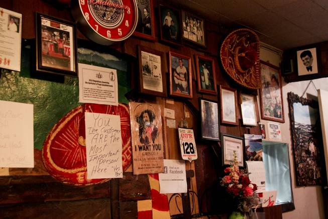 The interior decor on one of the walls at El Sombrero restaurant located on Main Street, which has been open since 1950, on its closing day Saturday, April 12, 2014.