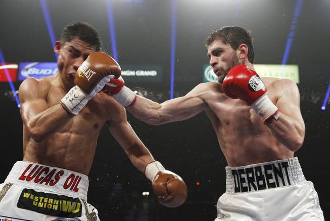 Jessie Vargas of Las Vegas is hit by Khabib Allakhverdiev of Russia during their WBA interim super lightweight fight at the MGM Grand Garden Arena on Saturday, April 12, 2014.