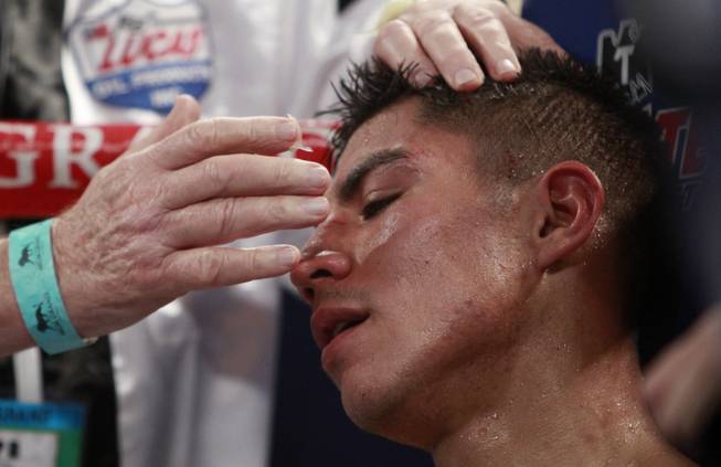 Jessie Vargas of Las Vegas is tended to in his corner between rounds of his WBA interim super lightweight fight against Khabib Allakhverdiev of Russia at the MGM Grand Garden Arena on Saturday, April 12, 2014.