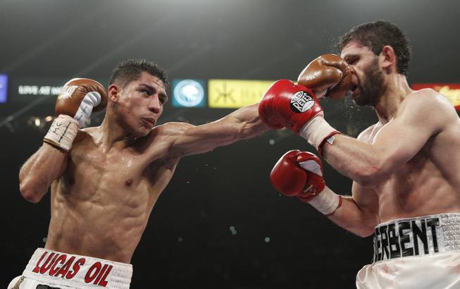 Jessie Vargas hits Khabib Allakhverdiev with a left during their WBA interim super lightweight fight at the MGM Grand Garden Arena on Saturday, April 12, 2014. Vargas won by unanimous decision.