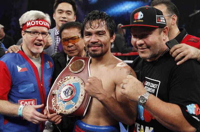 Manny Pacquiao of the Philippines celebrates his unanimous decision over WBO welterweight champion Timothy Bradley during their title fight at the MGM Grand Garden Arena on Saturday, April 12, 2014. Bradley was previously undefeated.