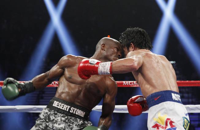 Timothy Bradley winds up to throw a right at Manny Pacquiao during their title fight at the MGM Grand Garden Arena on Saturday, April 12, 2014. Pacquiao won a unanimous decision.