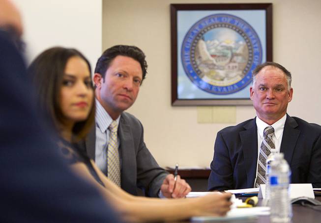 Hearing officer Brad Mamer, right, listens during a Nevada Economic Development Commission hearing at the Sawyer State Building Monday, April 14, 2014. A production company called LPF One DTIG LLC and affiliated with the Downtown Project is applying for a tax incentive for a proposed movie production starring Dakota Fanning that will be filmed in Las Vegas.