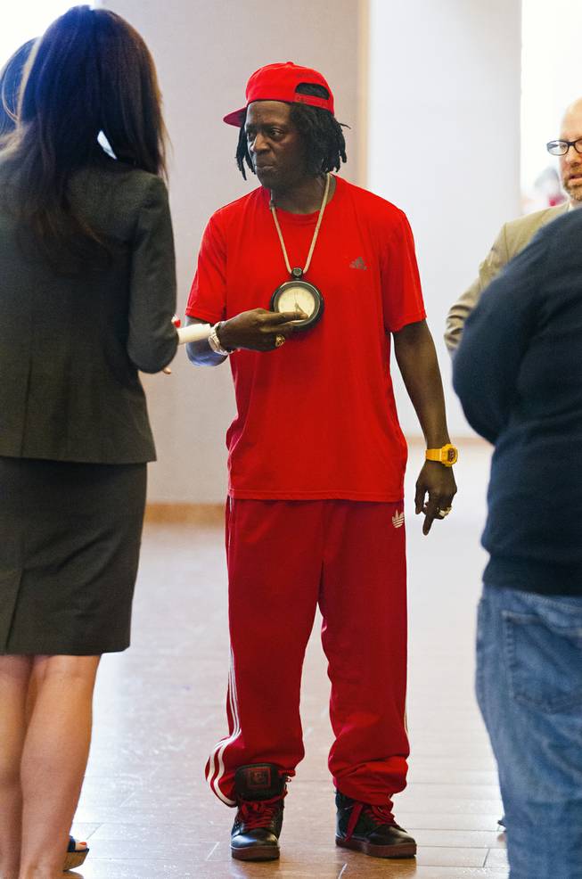 William Jonathan Drayton, Jr., aka Flavor Flav, talks with his legal staff appears following his appearance before Judge Kathy Hardcastle at the Regional Justice Center on Monday, April 14, 2014.