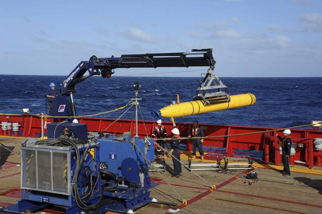 In this April 1, 2014, file photo, provided by the U.S. Navy, the Bluefin 21 autonomous sub is hoisted back on board the Australian Defense Vessel Ocean Shield after successful buoyancy testing in the Indian Ocean, as search efforts continued for missing Malaysia Airlines Flight 370.