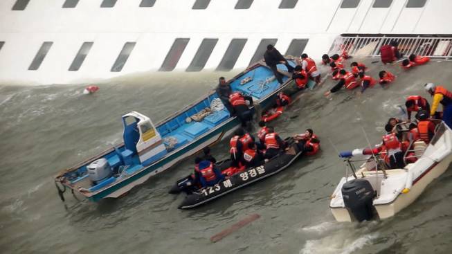In this image taken from video from Mokpo Coast Guard, passengers from a ferry sinking off South Korea's southern coast, are rescued by South Korean Coast guard in the water off the southern coast near Jindo, south of Seoul, Wednesday, April 16, 2014. Nearly 300 people were still missing Wednesday several hours after the ferry carrying 477, most of them high school students, sank in cold waters off South Korea's southern coast.