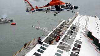 In this image taken from video released by News Y via Yonhap, passengers from a ferry sinking off South Korea's southern coast, are rescued by a South Korean Coast Guard helicopter in the water off the southern coast near Jindo, south of Seoul, Wednesday, April 16, 2014. Nearly 300 people were still missing Wednesday several hours after the ferry carrying 477, most of them high school students, sank in cold waters off South Korea's southern coast. 