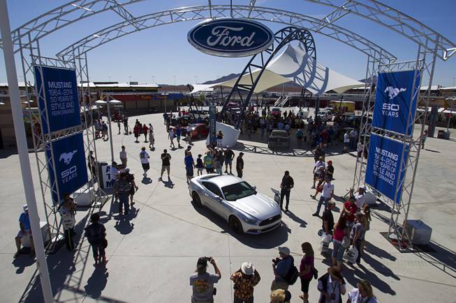 A 2015 Ford Mustang is displayed during the Mustang 50th Birthday Celebration at the Las Vegas Motor Speedway Thursday, April 17, 2014. The redesigned Mustang is expected to be available in late 2014. The celebration continues through Sunday.