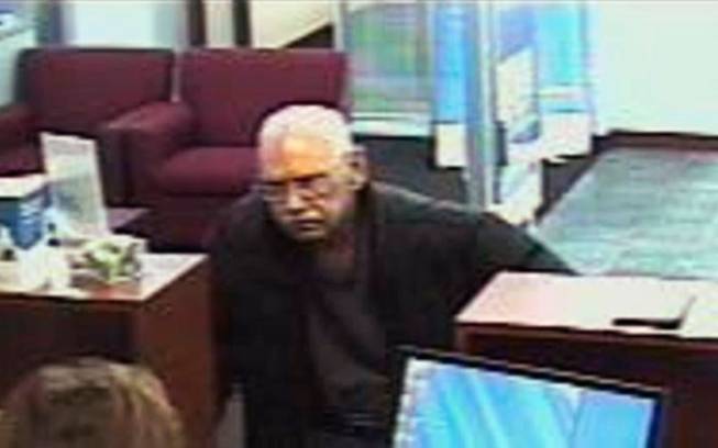 This Feb. 9, 2013 file surveillance photo provided by the FBI shows 73-year-old Walter Unbehaun, an ex-convict from Rock Hill., S.C., during a bank robbery in Niles, Ill. Unbehaun allegedly told investigators he intended to get caught so he could live his final years behind bars. On Thursday, April 17, 2014, Unbehaun is scheduled to be sentenced in Chicago. In 50 years, he has spent just six out from behind bars. His case highlights a wider societal dilemma about what to do with an increasingly elderly ex-cons, many of whom spent so much of their lives inside prison that they, like Unbehaun, can't cope with life on the outside.