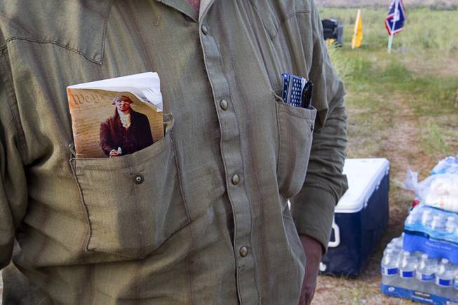 Ryan Bundy, son of rancher Cliven Bundy, carries a copy of the U.S. constitution in his shirt pocket during a Bundy family "Patriot Party" near Bunkerville Friday, April 18, 2014. The family organized the party to thank people who supported rancher Cliven Bundy in his dispute with the Bureau of Land Management.