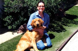 Jamie Hein with one of the dogs she trained as part of the prison’s Pups on Parole program. 