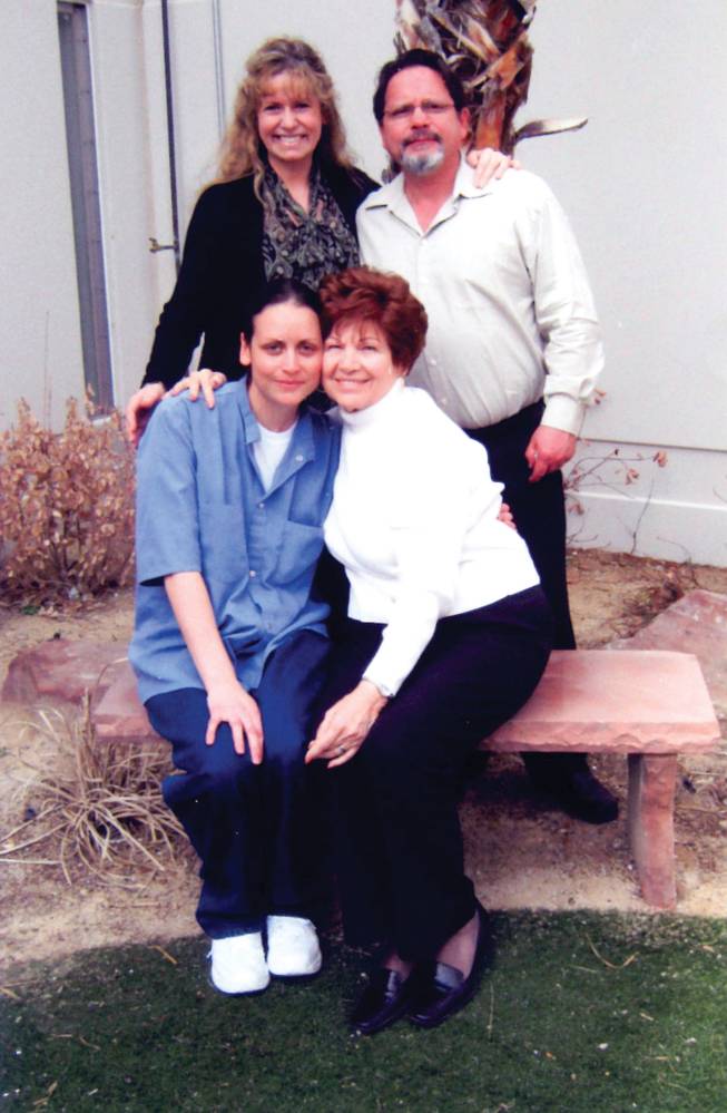 Jamie Hein, front left, is visited by her parents and Kathy Herman, front right, in prison March 6, 2010. Herman is the mother of Timothy Herman, whom Hein was convicted of murdering.