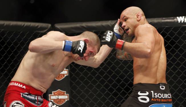 Thiago Alves, right, and Seth Baczynski fight in a mixed martial arts event on Saturday, April 19, 2014, at UFC Fight Night in Orlando, Fla. Alves won.