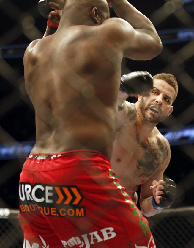 Derrick Lewis, left, and Jack May fight in a mixed martial arts event on Saturday, April 19, 2014, at UFC Fight Night in Orlando, Fla. Lewis won.