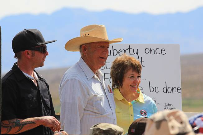 Rancher Cliven Bundy, center, and his wife Carol are shown at a meeting with supporters before the April 12, 2014 stand-off between the Bureau of Land Management and supporters of rancher Cliven Bundy near Bunkerville, Nevada. The BLM eventually called off their roundup of Bundy cattle citing safety concerns. Courtesy of Shannon Bushman.