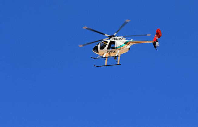 A Metro Police helicopter flies over the April 12, 2014 stand-off between the Bureau of Land Management and supporters of rancher Cliven Bundy near Bunkerville, Nevada. The BLM eventually called off their roundup of Bundy cattle citing safety concerns. Courtesy of Shannon Bushman.