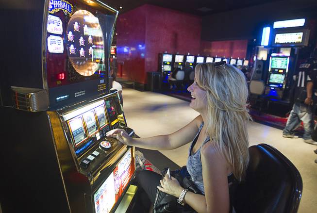 Laurie Sibilia of Canton, Ohio plays slots during the opening of the casino floor at the Cromwell, formerly Bill's Gamblin' Hall & Saloon, on the Las Vegas Strip and Flamingo Avenue, Monday, April 21, 2014. The casino is undergoing a $185 million renovation project that includes remodeling of guest rooms, casino floor and common areas, the addition of a new second floor restaurant, and construction of the 65,000 square foot rooftop pool and dayclub/nightclub.