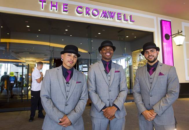 Doormen Jojo Corpus, left, Gary Harris, center, and Santiago Ortega pose in the Cromwell porte cochere during the opening of the casino floor at the Cromwell, formerly Bill's Gamblin' Hall & Saloon, Monday, April 21, 2014. The casino is undergoing a $185 million renovation project that includes remodeling of guest rooms, casino floor and common areas, the addition of a new second floor restaurant, and construction of the 65,000 square foot rooftop pool and dayclub/nightclub.