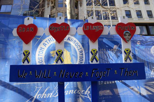 Shown is a makeshift memorial for the Boston Marathon bombing victims near the finish line ahead of Monday's 118th Boston Marathon, Saturday, April 19, 2014, in Boston. 