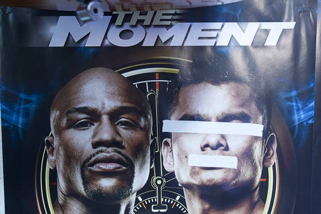 Tape is shown on a poster featuring the images of WBC welterweight champion Floyd Mayweather Jr. (L) and WBA champion Marcos Maidana in the Mayweather Boxing Club Tuesday, April 22, 2014. Mayweather is preparing for his fight against Maidana of Argentina at the MGM Grand Garden Arena on May 3.