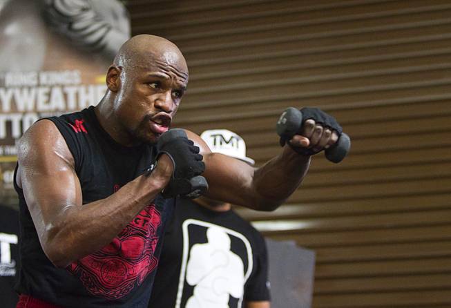 WBC welterweight champion Floyd Mayweather Jr. works out with weights at the Mayweather Boxing Club Tuesday, April 22, 2014. Mayweather is preparing for his fight against WBA champion Marcos Maidana of Argentina at the MGM Grand Garden Arena on May 3.