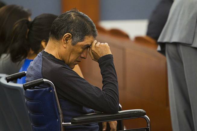 Lorenzo Alavez waits for the sentencing for Nyakueth Tear of Salt Lake City, Utah at the Regional Justice Center Tuesday, April 22, 2014. Tear struck eight pedestrians with her car in the street outside of a North Las Vegas church in August 2013 and fled the scene. Alavez was permanently disabled after the accident.