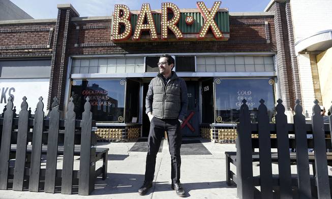 Actor Ty Burrell, who plays bumbling dad Phil Dunphy on ABC's “Modern Family,” stands outside Bar X, the cocktail bar he co-owns in Salt Lake City on Wednesday, April 16, 2014. 