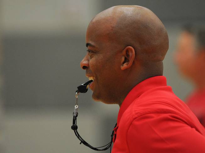UNLV alumni Dedan Thomas smiles as he conducts drills with a youth basketball team inside the Western Tech High School gymnasium on Tuesday, April 22, 2014.. Thomas played point guard for the UNLV Runnin' Rebels during the final season of head coach Jerry Tarkanian in 1991-1992.
