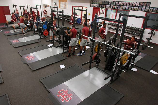 Cimarron Memorial students lift weights in their new weight room Tuesday, April 22, 2014.