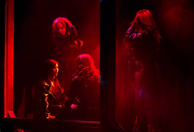 Dancers are bathed in red light as “X Burlesque” celebrates its 12th anniversary in Las Vegas on Wednesday, April 23, 2014, at the Flamingo.
