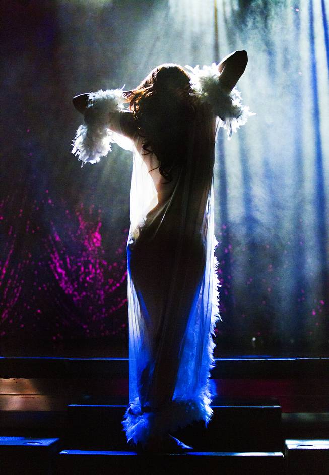 A dancer is back lit as “X Burlesque” celebrates its 12th anniversary in Las Vegas on Wednesday, April 23, 2014, at the Flamingo.