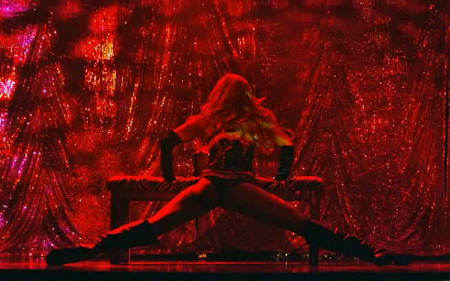 A dancer is bathed in red light as “X Burlesque” celebrates its 12th anniversary in Las Vegas on Wednesday, April 23, 2014, at the Flamingo.