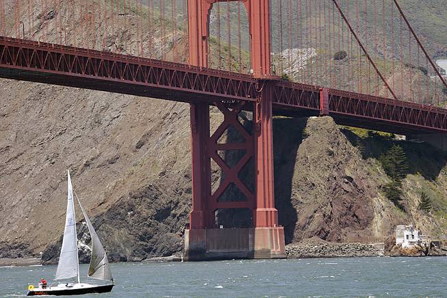 A sailboat makes its way under the Golden Gate Bridge on Wednesday, April 23, 2014, in San Francisco. A National Oceanic and Atmospheric Administration team has found the shipwreck of the City of Chester vessel in the area.