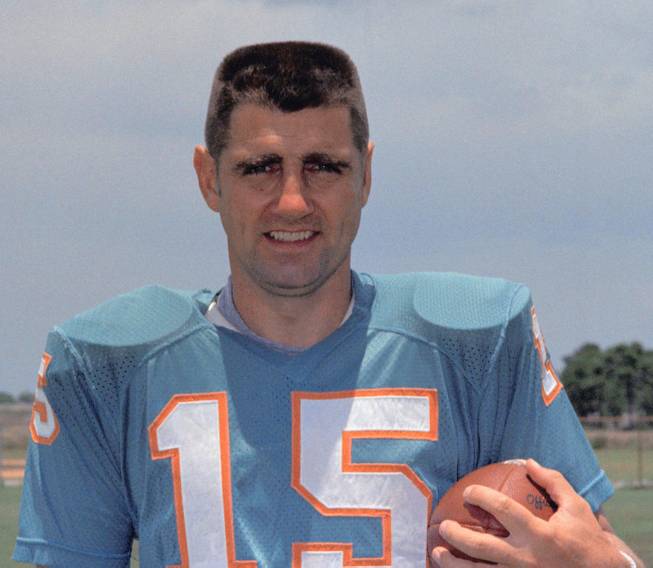 This is a 1972 file photo showing Miami Dolphins quarterback Earl Morrall. Morrall, an NFL quarterback for 21 years who started nine games during the Miami Dolphins' perfect season in 1972, has died at age 79. The Dolphins confirmed Morrall's death Friday, April 25, 2014.