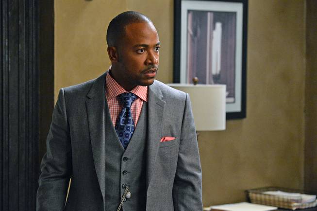 This image released by ABC shows Columbus Short as Harrison Wright in a scene from "Scandal." The 31-year-old actor said in a statement Friday, April 25, 2014, that he's exiting the political thriller after three seasons. 