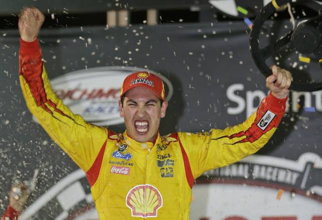 Joey Logano celebrates his win in the NASCAR Sprint Cup auto race at Richmond International Raceway in Richmond, Va., Saturday, April 26, 2014.