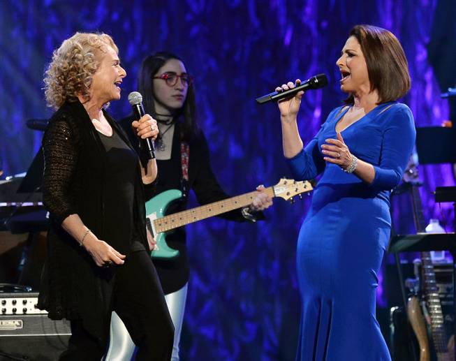 Singer/songwriter Carole King, musician Emily Estefan and honoree Gloria Estefan perform during the 18th annual Keep Memory Alive “Power of Love Gala” benefit for the Cleveland Clinic Lou Ruvo Center for Brain Health honoring Gloria Estefan and Emilio Estefan Jr. on Saturday, April 26, 2014, at MGM Grand Garden Arena.

