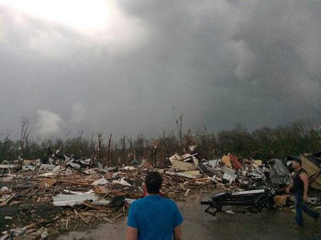 This photo provided by James Bryant shows tornado damage, Sunday, April 27, 2014 in Mayflower, Ark. 