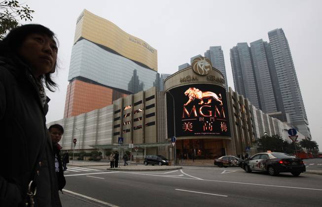 This Feb. 15, 2011, file photo shows a promotional screen with the Chinese characters for MGM displayed at the MGM Grand Macau casino resort, in Macau. MGM Resorts reported quarterly earnings on Tuesday, April 29, 2014.