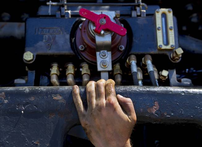 Austin Barker with heritage operations for the Union Pacific Railroad, continues maintenance on the mechanical lubricator beneath the Big Boy No. 4014 steam locomotive stopped at the Union Pacific Railroad in Las Vegas on Wednesday, April 30, 2014.