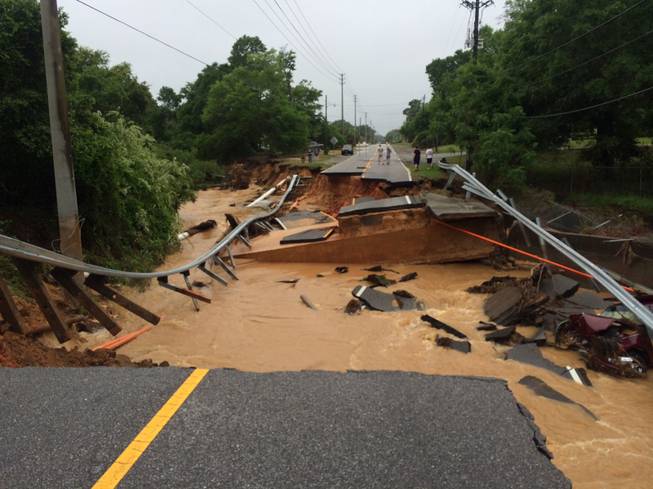 In this image provided by Brantly S. Keiek shows a section of the Scenic Highway that collapsed due to heavy rain in Pensacola, Fla., Thursday, April 30, 2014. 