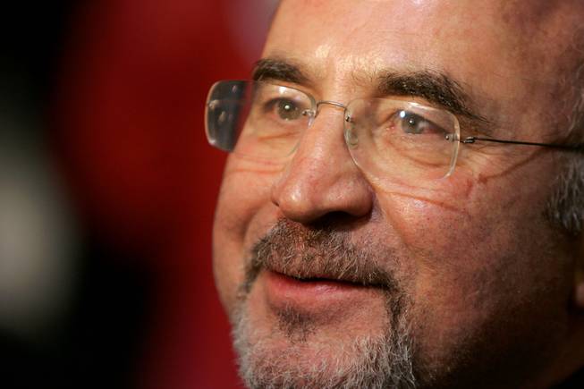 This Oct. 30, 2006, photo shows British actor Bob Hoskins giving a television interview as he arrives at a gala screening for the film 'Hollywoodland' as part of the London Film Festival at a West End cinema in Leicester Square, London.