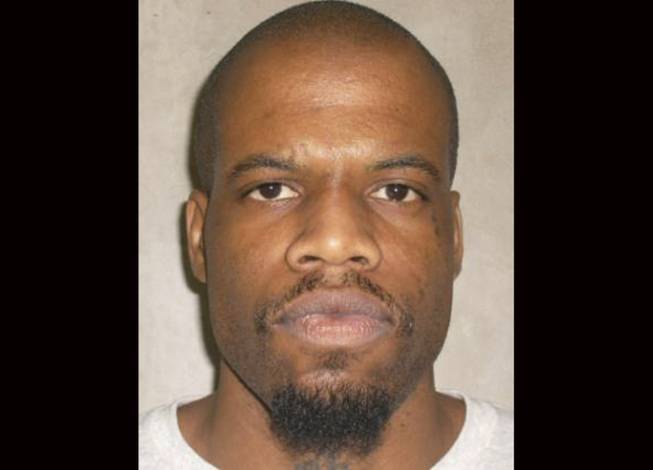 This June 29, 2011, file photo provided by the Oklahoma Department of Corrections shows Clayton Lockett. Oklahoma prison officials halted the execution of Lockett Tuesday, April 29, 2014, after the delivery of a new three-drug combination failed to go as planned.
